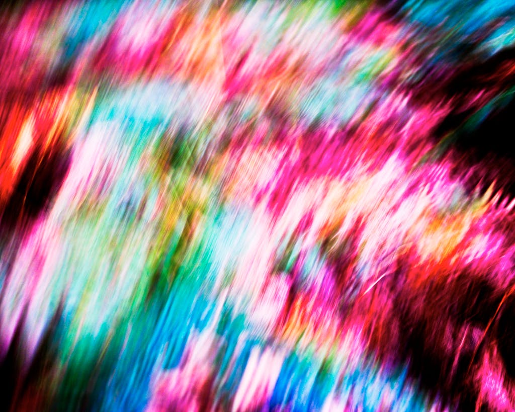 Dynamic abstract background with vivid colors and blurred motion effect.